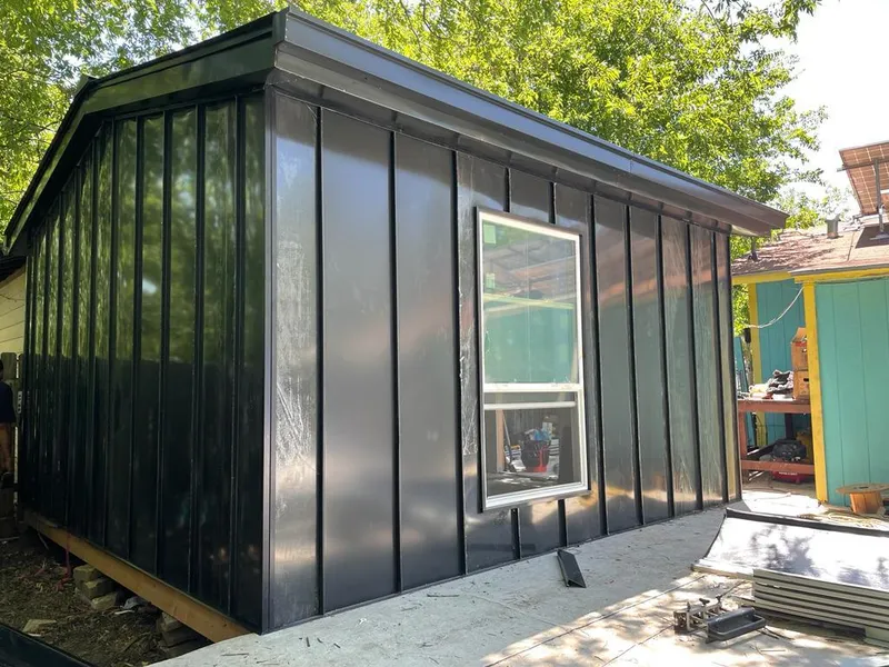 Black standing seam metal wall panels for Roof Inspection in French Valley