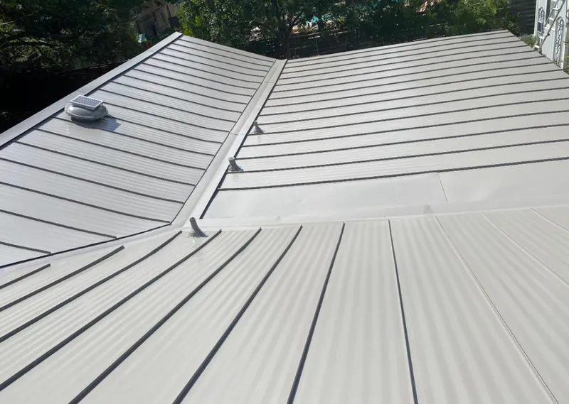Solar attic fan installed on a metal roof for Roof Ventilation in French Valley